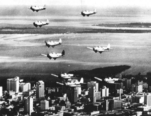 WWll aircraft flying over downtown Miami