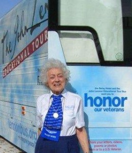 Helen standing with John Lennon Bus